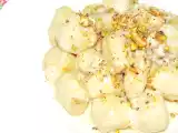 Ricetta Gnocchi di patate al gorgonzola gratinati con provola, noci e pistacchi