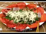 Ricetta Carpaccio di manzo con rucola e scaglie di parmigiano