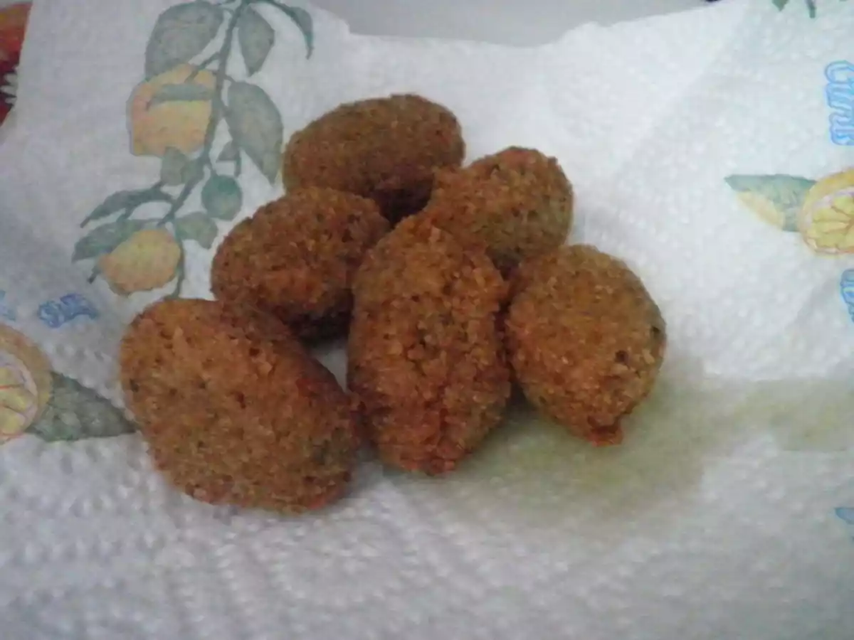 Olive di Cerignola farcite con salsiccia panate e fritte - foto 2